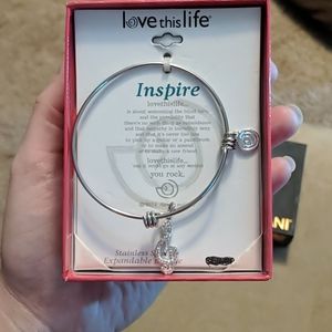 Silver bracelet with treble clef charm